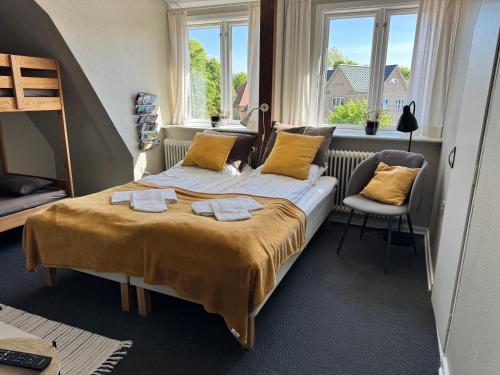 Postel nebo postele na pokoji v ubytování Gredstedbro Hotel