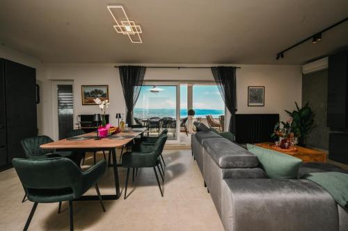 a living room with a couch and a table at Petra Hills Majestic in Opatija