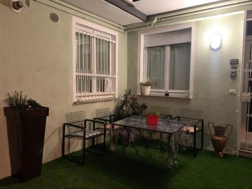 a room with a table and chairs and a window at Casa Lago Leo in Omegna