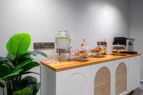 a buffet with food in glass bowls on it at Smart and Simple Hotel Karakoy in Istanbul