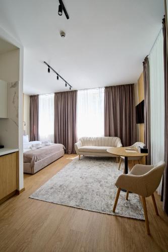 a large living room with a couch and a table at Forest Retreat Center in Kyiv