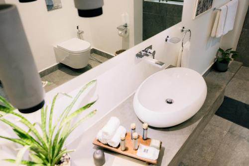 a bathroom with a white tub and a sink at Nuuk Taal Lake in Laurel