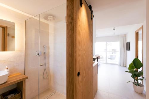 a bathroom with a shower and a sink at Malacosta A - MC Apartments Ibiza in Ibiza Town