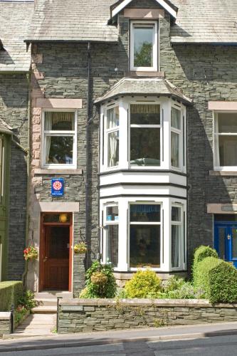 a brick house with a front door at Brookfield B&B Guest House in Keswick