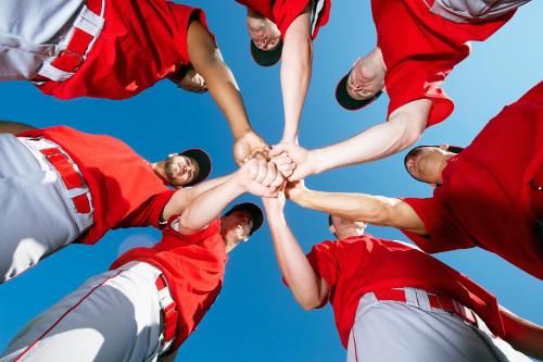 a group of baseball players holding their hands together at Country Inn & Suites by Radisson, Anderson, SC in Anderson