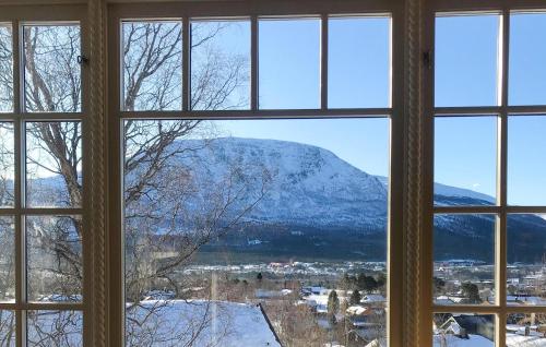 a view of a mountain from a window at 2 Bedroom Lovely Home In Oppdal in Oppdal