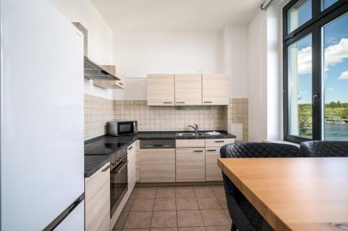 Køkken eller tekøkken på Ferienapartment Blue Sea - Seeblick, Komfort und Kamin in Malchow