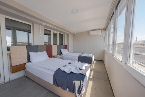 a room with a bed and two chairs in it at Diamond Hotel in Istanbul
