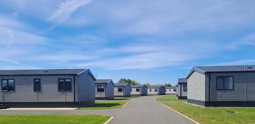 a row of modular homes in a row at Addlethorpe Golf & Country Club, Ingoldmells in Addlethorpe