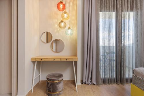 a room with a table with mirrors and a window at Villa Shangri-La Zakinthos in Zakynthos Town