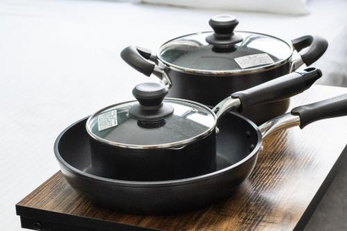 two pots sitting on top of a wooden cutting board at LudiCent717 - Vacation STAY 08169v in Toyohira
