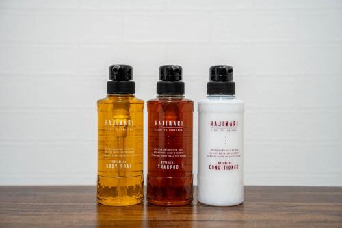 three bottles of essential oils sitting on a table at LudiCent717 - Vacation STAY 08169v in Toyohira