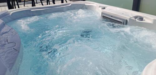 a jacuzzi tub filled with blue water at North Shore Holiday Park, Skegness in Winthorpe