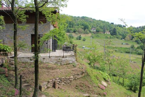 a house on the side of a hill at Al Pörtec in Sotto il Monte