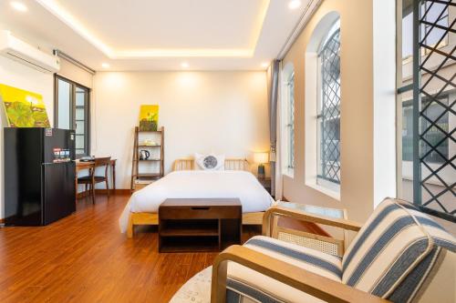 Ein Bett oder Betten in einem Zimmer der Unterkunft Nguyen Le Home - Nguyen Dinh Chieu, District 1
