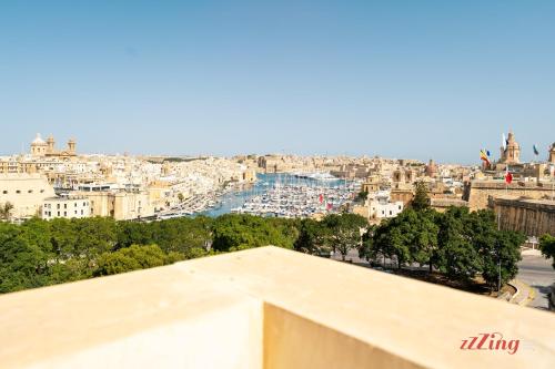 a view of the city from the roof of a building at Yolanda Boutique Suites by Zzzing in Birgu