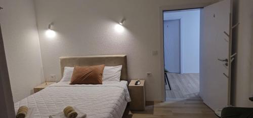 Katil atau katil-katil dalam bilik di Apartments&studio Villa Antigona