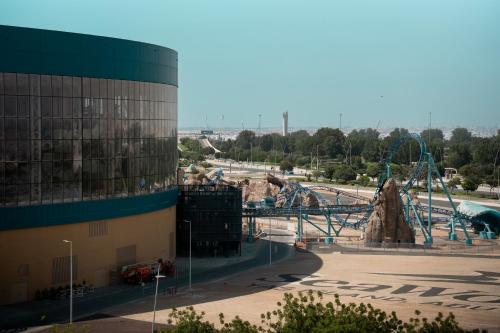 a view of a water park with a roller coaster at Yas Island 3BR plus Maid Pool, Gym, Near SeaWorld & Ferrari World in Abu Dhabi