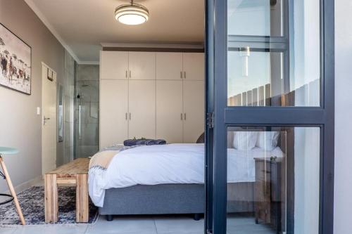 Ένα ή περισσότερα κρεβάτια σε δωμάτιο στο Nguni House