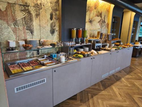 a buffet line with many different types of food at Hotel Vita in Salò