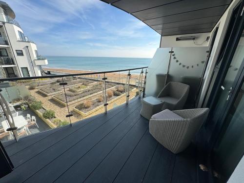a balcony with a view of the ocean at Apartment in Kent Beachfront NEW in Ramsgate