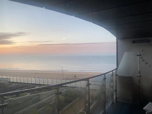 a view of the beach from a balcony at Apartment in Kent Beachfront NEW in Ramsgate