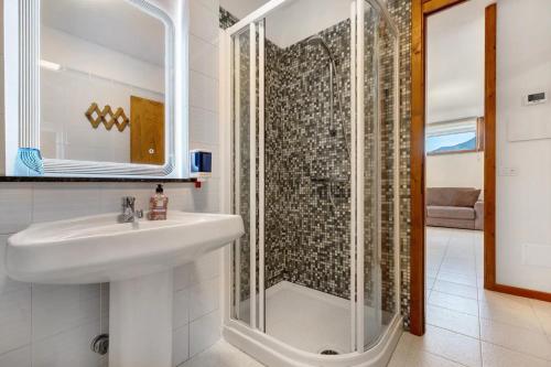 a bathroom with a sink and a shower at Appartamento SOLE in Brenzone sul Garda