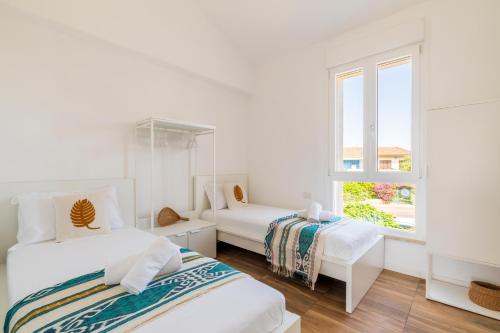 Postel nebo postele na pokoji v ubytování Sardinian Pearl - Poetto Beach Villa, South Sardinia