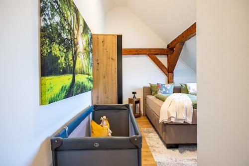 a living room with a couch and a bed at Haus Grande-Familienidyll am See in Neubrandenburg