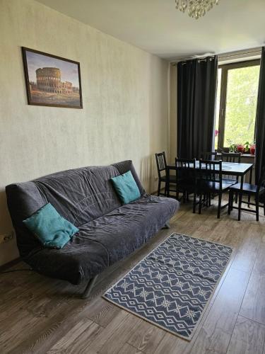 a living room with a couch and a dining room at House of Westeros - KingsLanding in Chişinău
