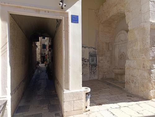 an alley with an archway in a building at Little Lion in Split