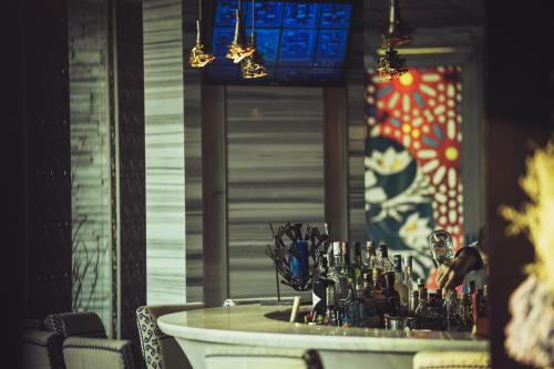 a table with a bunch of glasses on it at TUI BLUE Maduzi Hotel Bangkok in Bangkok