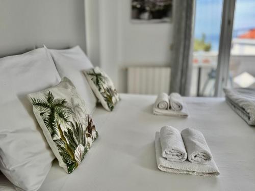 a white table with towels and pillows on it at Emanuela 1 in Novalja