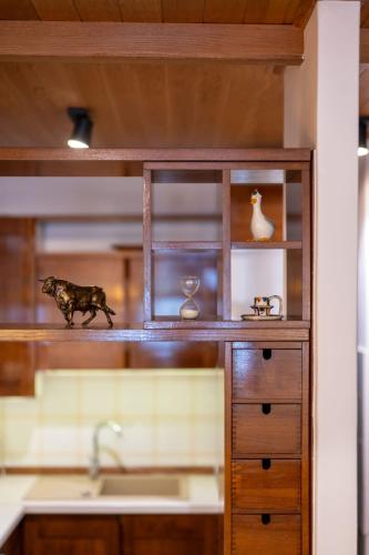 a kitchen counter with a sink and a wooden cabinet at Quiet Villa near Split, Heated Pool, View, Nature in Klis