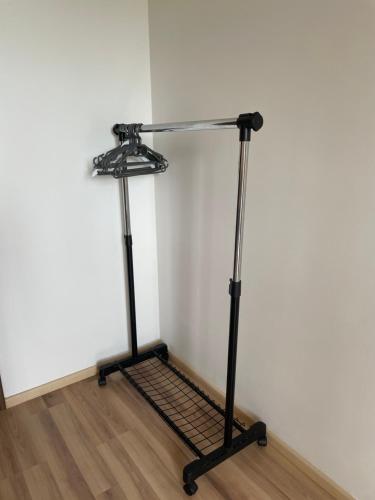 a metal stand in a room with a white wall at 7 people - 1 price - Cozy attic apartment in Prešov