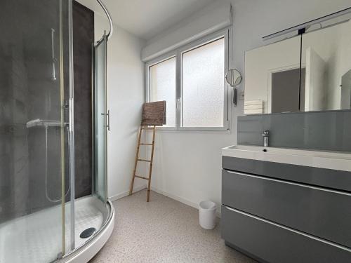 a bathroom with a shower and a sink and a mirror at Maison 3 étoiles au centre des Sables d'Olonne avec accès plage, Wifi et garage - FR-1-197-519 in Les Sables-dʼOlonne