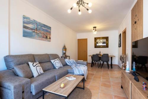 a living room with a couch and a table at Todimer Mediterranean Relax in Ítrabo