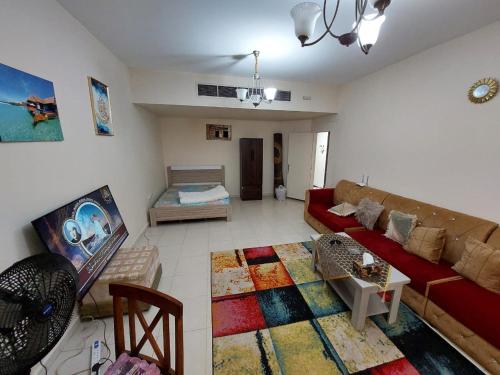 Televisyen dan/atau pusat hiburan di Friends Hotel Apartments