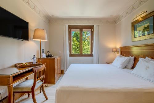 Кровать или кровати в номере Hotel Inglaterra
