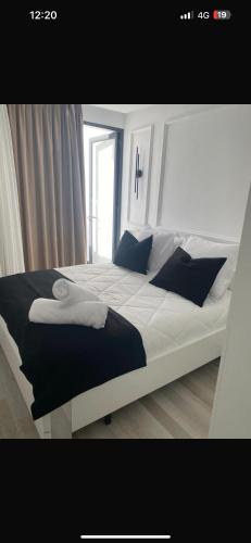 a bedroom with a large bed with a cross on it at Studio luxueux et contemporain in Casablanca