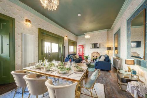 a dining room with a table and chairs at The Royal Mint apartment at The Bank of England in Bristol