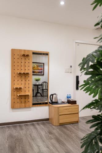a room with a table and a mirror at A Boi Apartment at District 3 in Ho Chi Minh City
