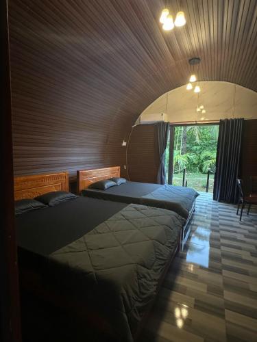 Postel nebo postele na pokoji v ubytování Mây's Garden Villa
