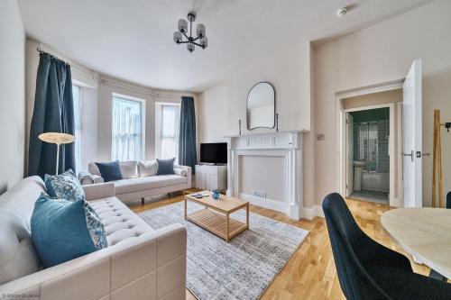 a living room with a couch and a table at Number 5 in Margate