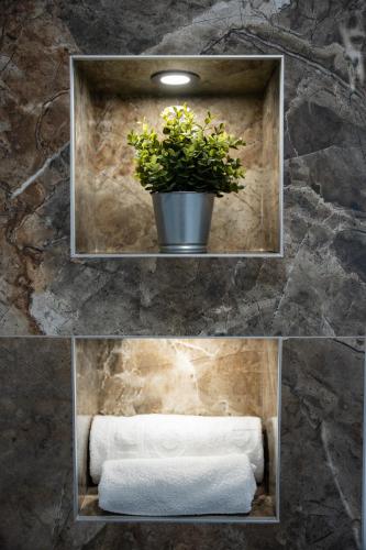 two pictures of a bathroom with a plant and towels at Villa London in Novalja