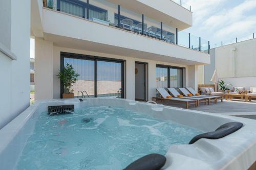 a hot tub in the backyard of a house at Beach Villa with ocean view in Lourinhã