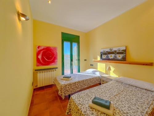 a room with two beds and a window at Holiday Home in Palamós near the Beach in Palamós