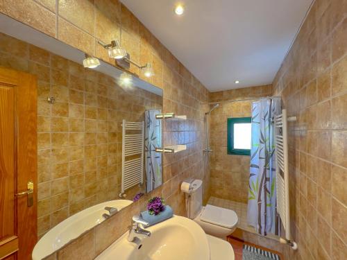 a bathroom with a sink and a toilet at Holiday Home in Palamós near the Beach in Palamós