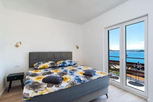 Postel nebo postele na pokoji v ubytování Apartmani Marino