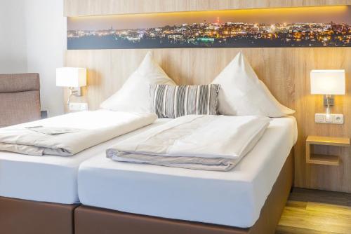 Katil atau katil-katil dalam bilik di Hotel Restaurant Kromberg